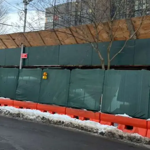 A worker silhouette on scaffolding